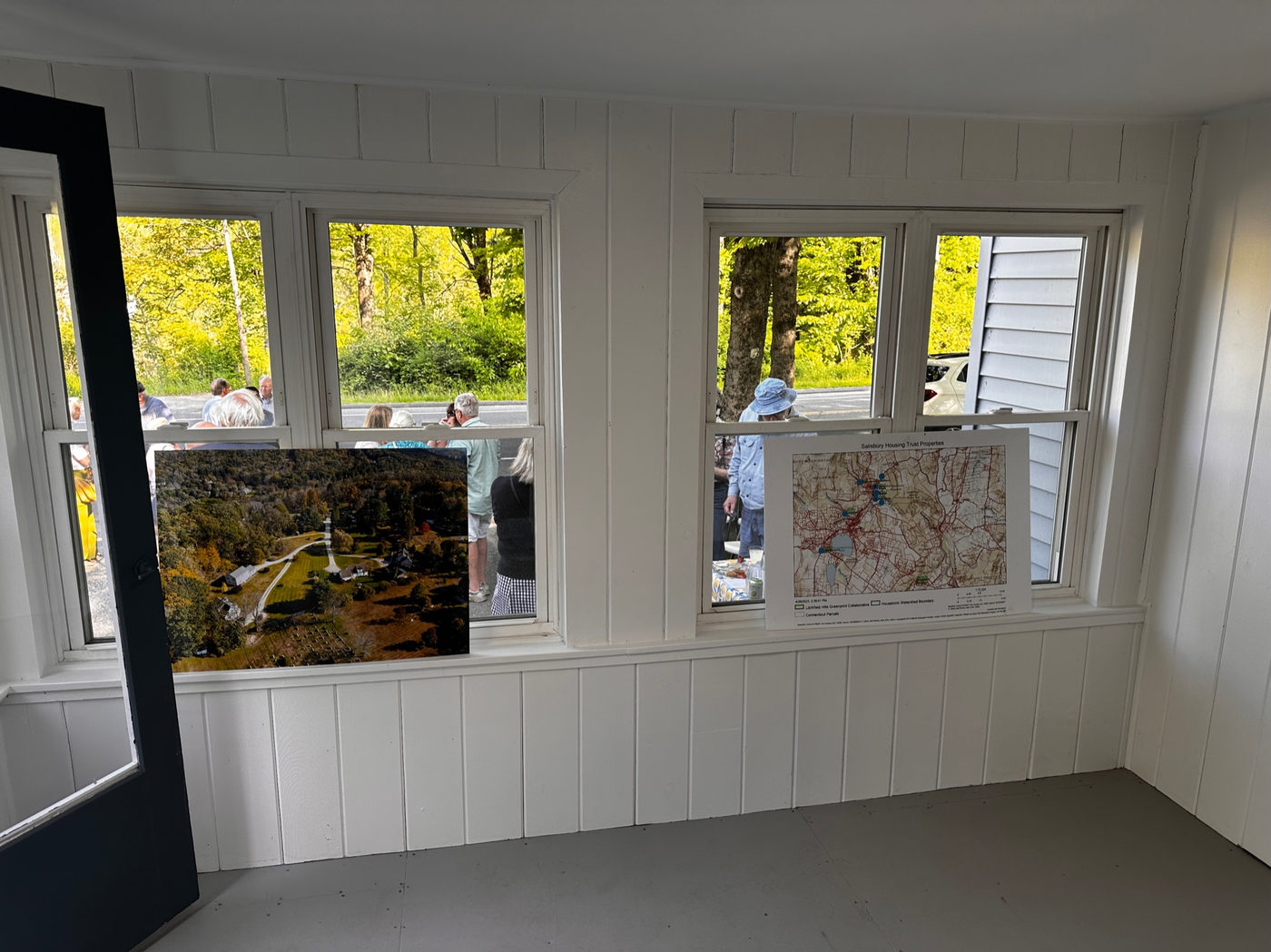 Window seat beneath a bank of white-trimmed windows